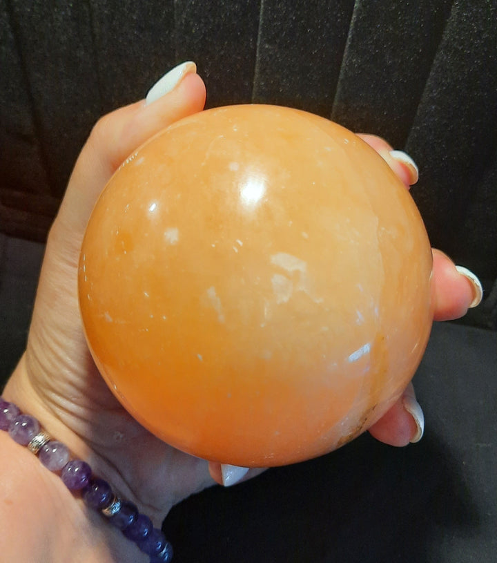 Orange Calcite Sphere 920 grams.